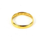 An unmarked gold wedding band having inscription to inside of shank. Weight 3.