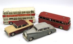 Four Dinky diecast vehicles.