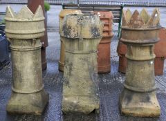 A king and queen chimney pot and another.