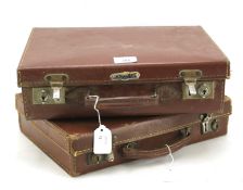 Two 1930s child's suitcases containing an assortment of early 20th century playing cards.