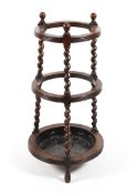 A 19th century oak barley twist stick stand.