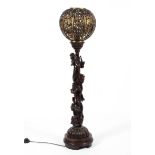 A carved wood and gilt-metal floor lamp, late 19th/early 20th century.