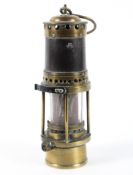 A brass Thomas & Williams Welsh miners lamp.