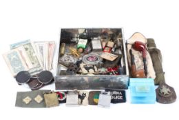 An assortment of mixed collectables, including a Dunhill lighter, early goggles, car mascot,