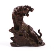 A small Chinese bronze in the form of a tiger.