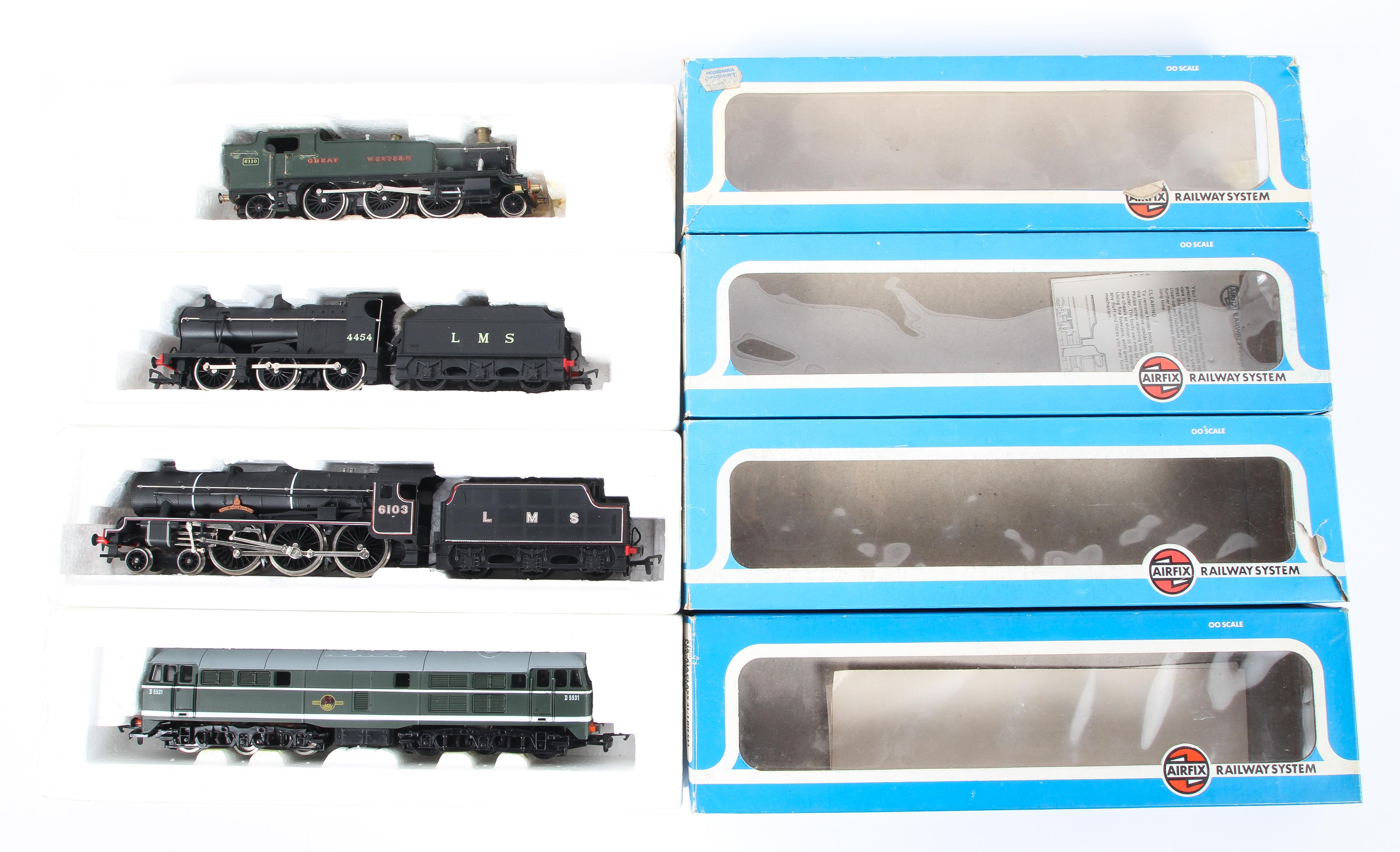 A mixed collection of OO gauge locomotives and tenders.