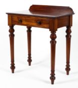 A Victorian mahogany single drawer side table with gallery back.