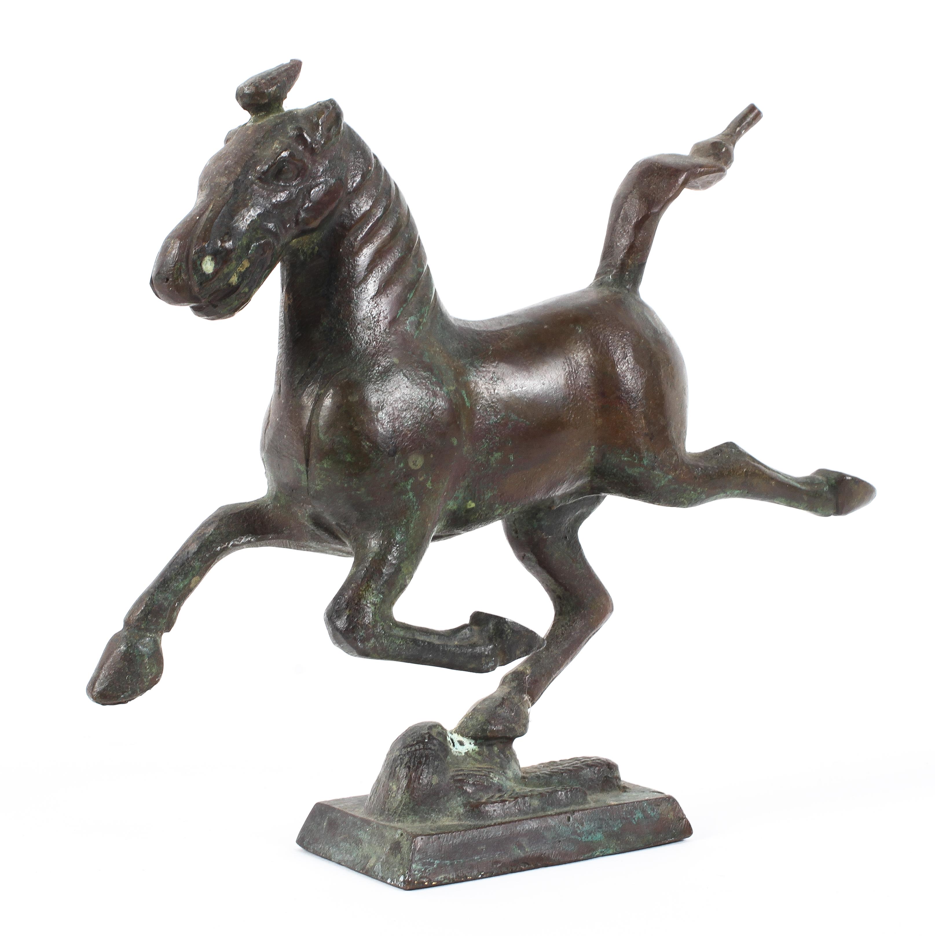 A Chinese archaic-style bronze model of a horse.