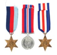 A group of three WW II medals.