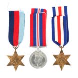 A group of three WW II medals.