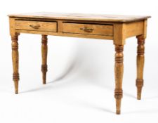 A late 19th century pine two drawer side table. Raised on turned supports, L120cm x D58.