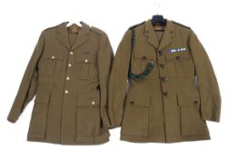 Two Rifles army jackets, both with related buttons and badges.