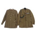 Two Rifles army jackets, both with related buttons and badges.