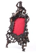 A Victorian bronze photo frame.