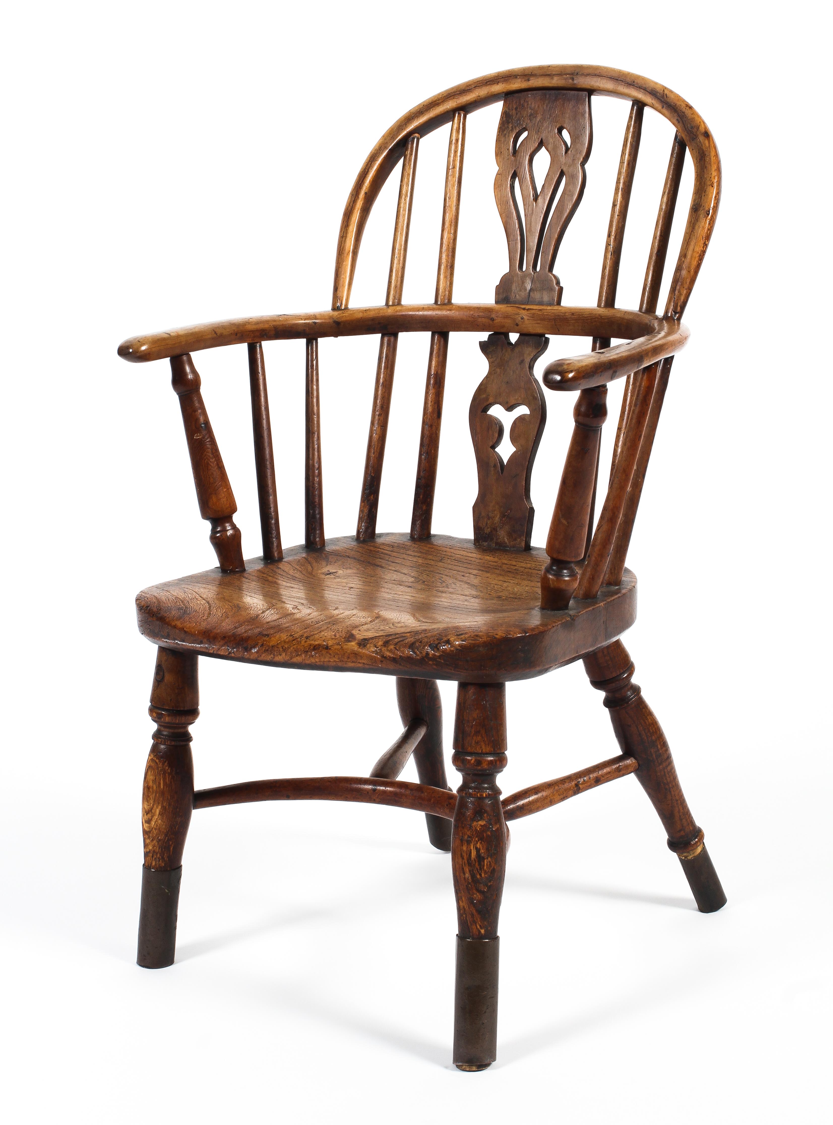 A 19th century elm and fruitwood child's Windsor chair.