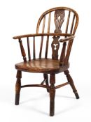 A 19th century elm and fruitwood child's Windsor chair.