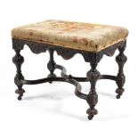 A William and Mary carved mahogany footstool, late 17th century.