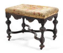 A William and Mary carved mahogany footstool, late 17th century.