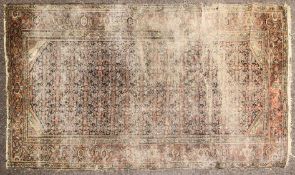 A 19th century Persian rug with multiple borders on a red ground.