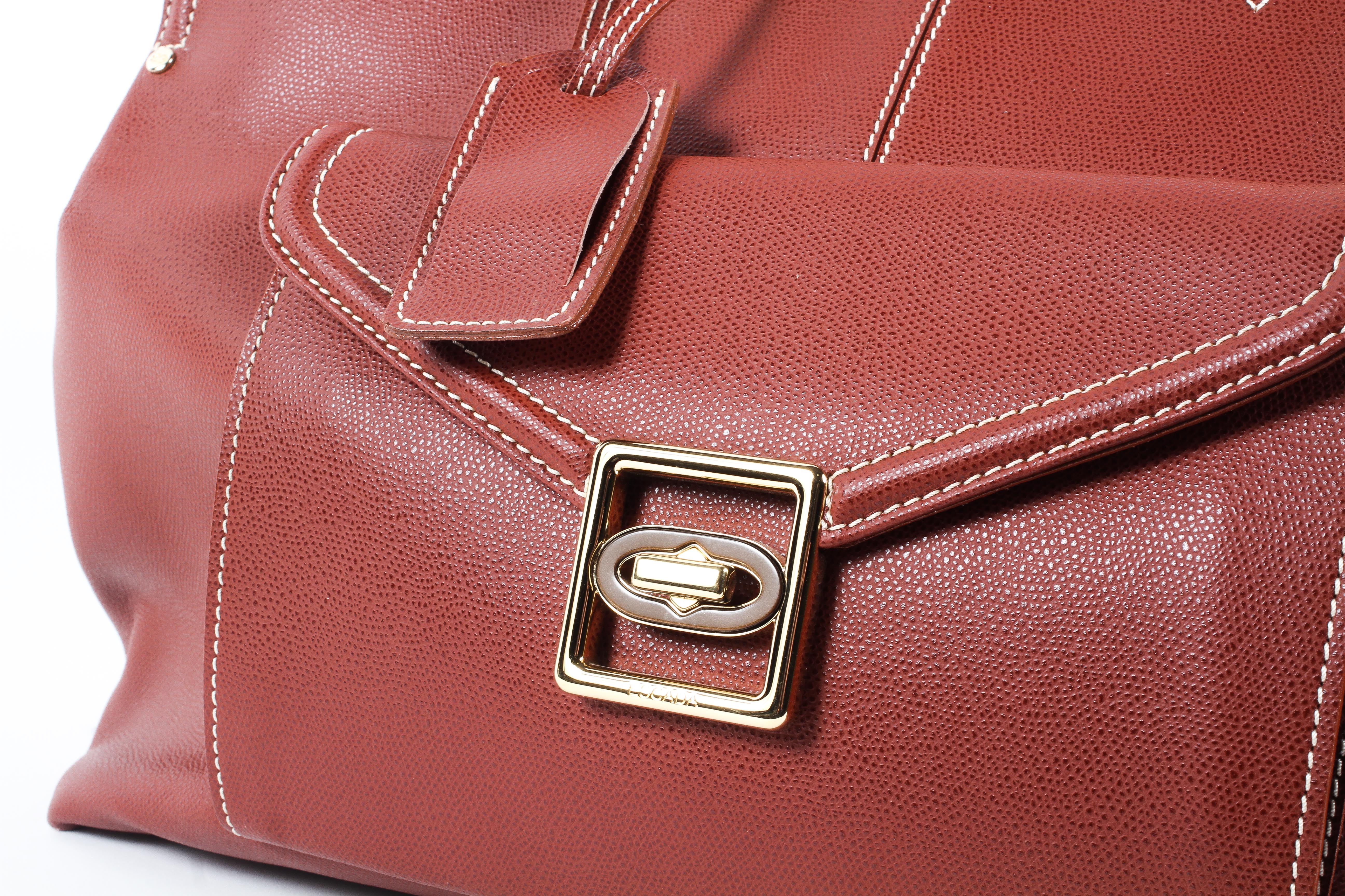 An Escade burgundy leather travel bag and dust bag Condition Report: Overall in good - Image 6 of 6