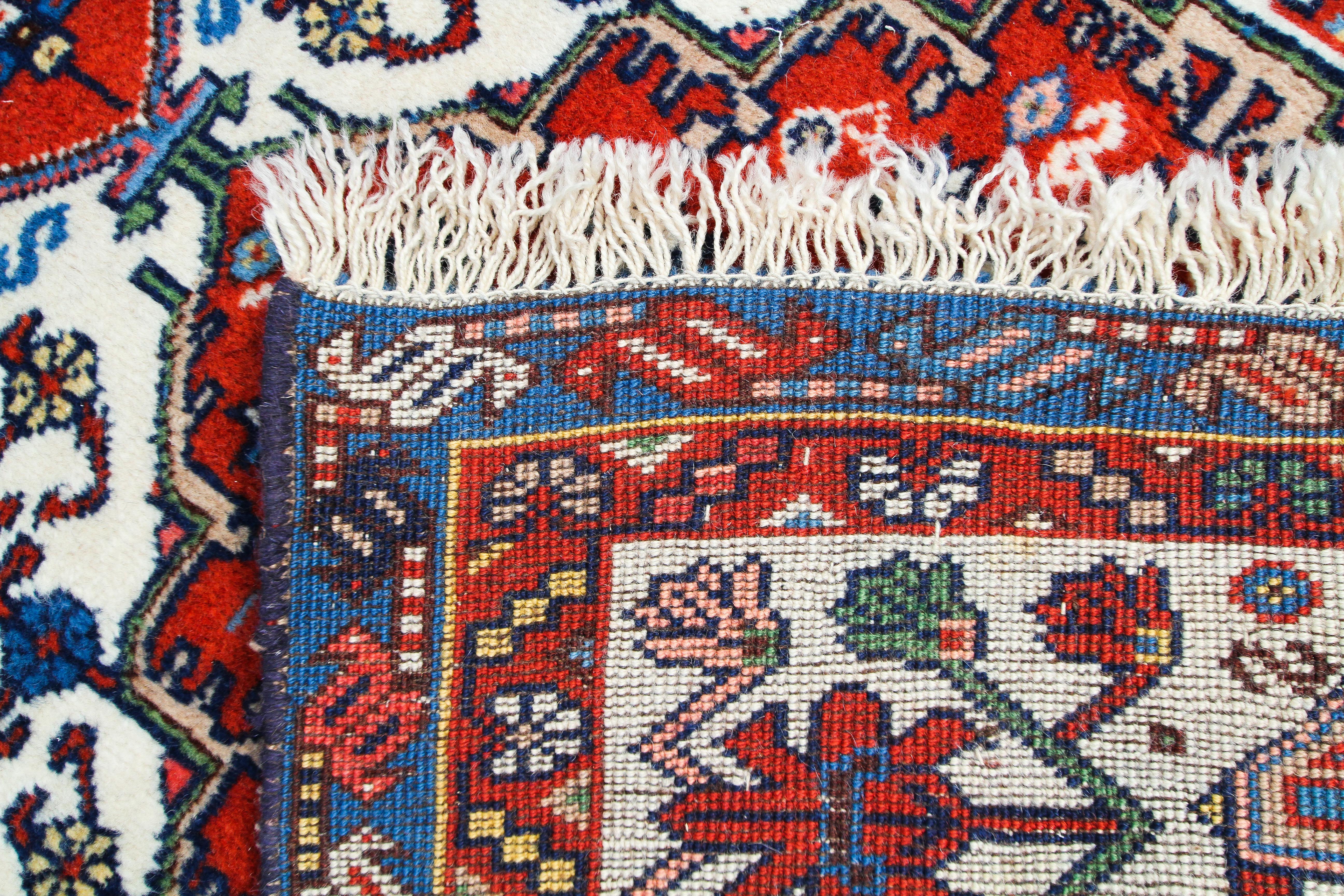 A Tabriz small runner with blue and red medallion on red blue cream ground 352x80cm - Image 3 of 3