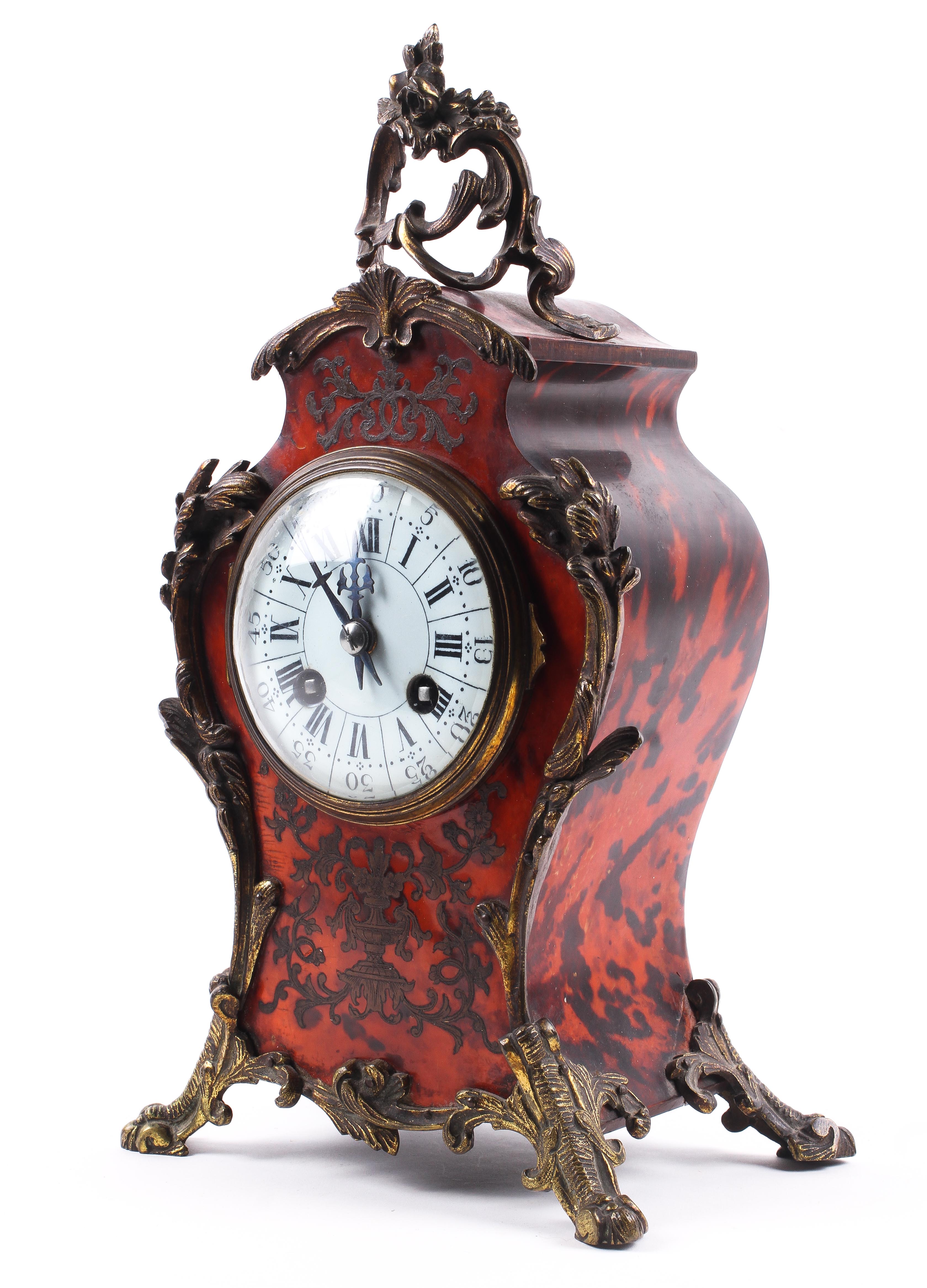 A late 19th century French boulle work and gilt-metal mounted eight day mantel clock.