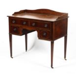 An Edwardian mahogany inlaid ladies kneehole desk.