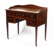 An Edwardian mahogany inlaid ladies kneehole desk.