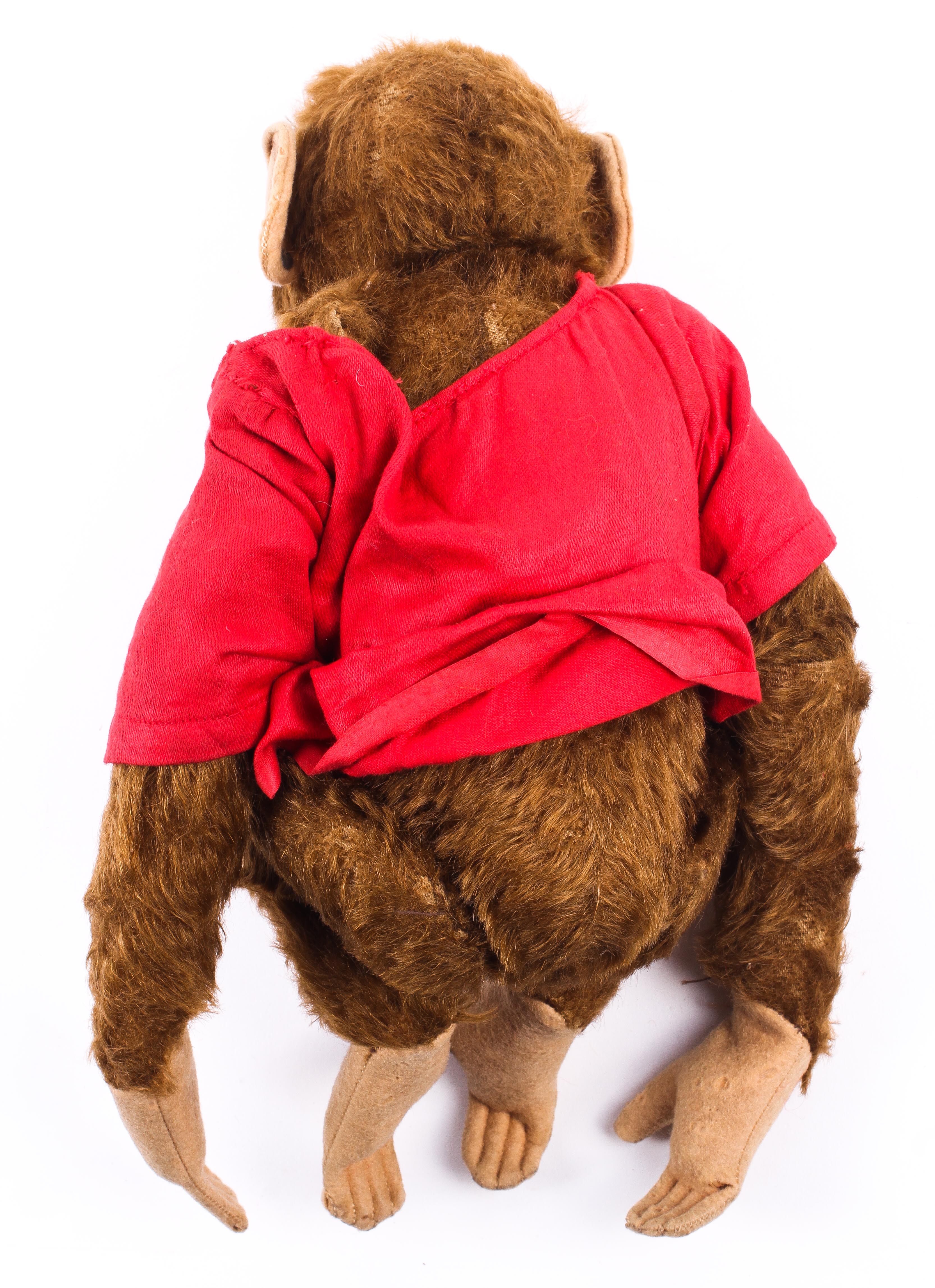 A Steiff monkey wearing a red jacket, early/mid-20th century. - Image 2 of 2