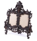 A Victorian bronze double photo frame.