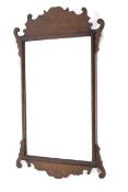 A Georgian style walnut pier mirror.