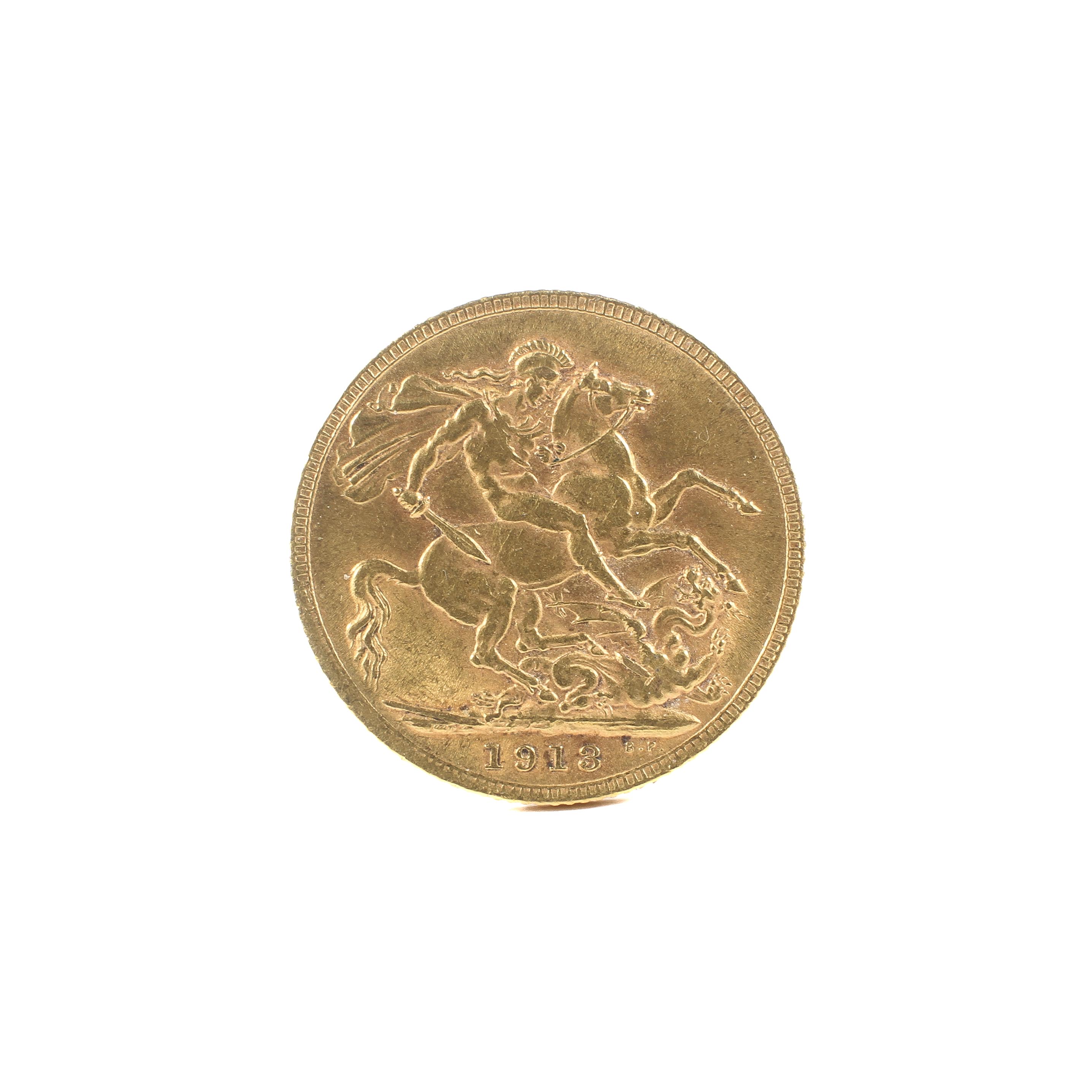 A George V 22ct gold full sovereign. Dated 1913, weight 7. - Image 2 of 2