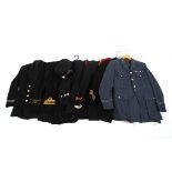 A collection of seven military uniforms.