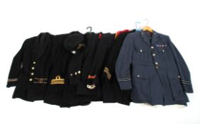 A collection of seven military uniforms.