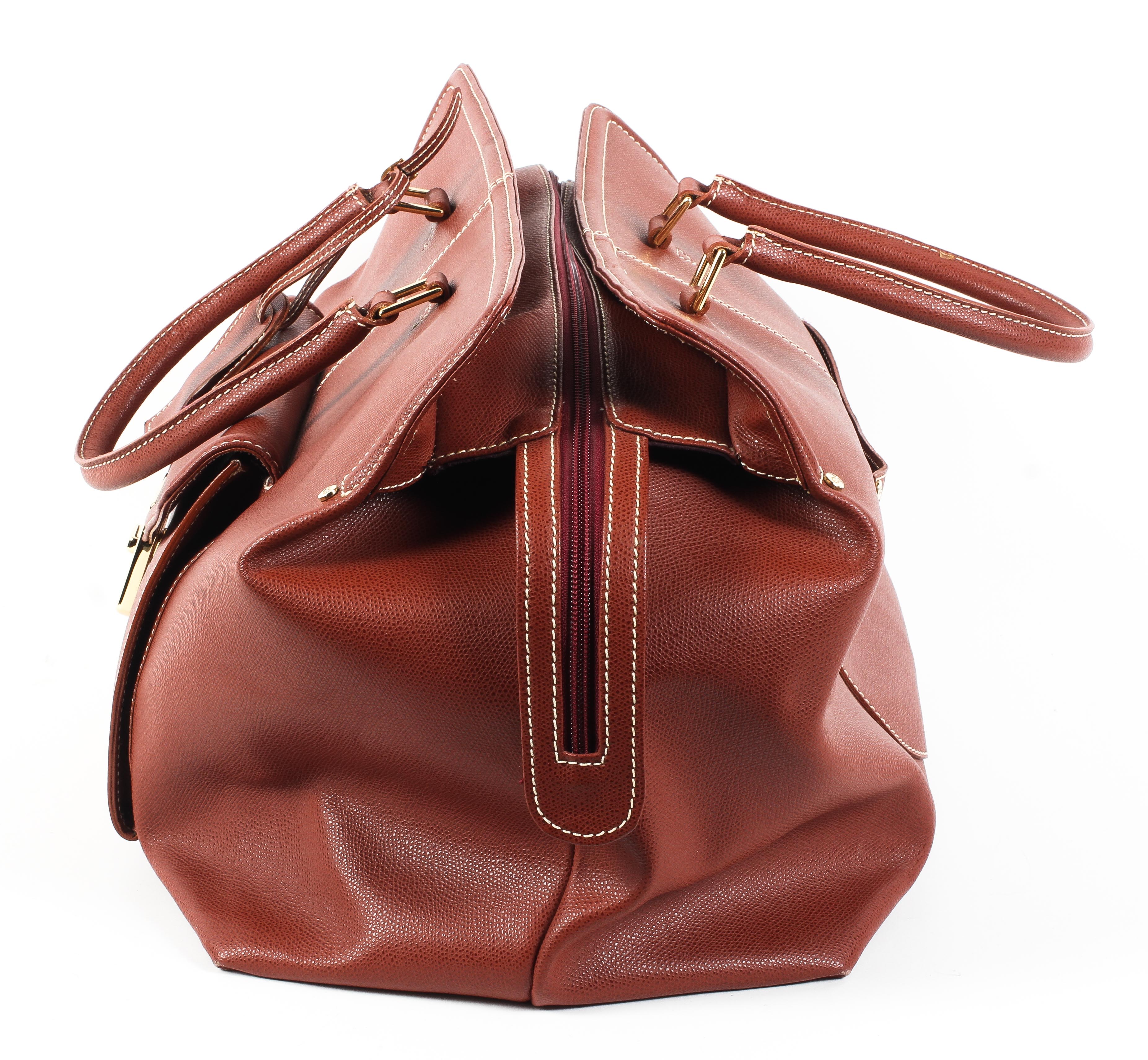 An Escade burgundy leather travel bag and dust bag Condition Report: Overall in good - Image 2 of 6