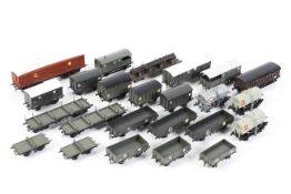 A box of assorted OO gauge rolling stock.