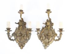 A pair of early 20th century gilt metal wall lights.