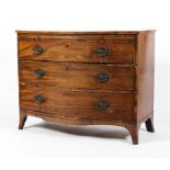 An early 19th century mahogany bow fronted chest of drawers.