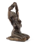 A fine bronzed resin figure of a naked lady in outstretched pose.
