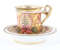 An early 19th century Derby gilt-ground coffee cabinet cup and saucer.