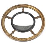 A Regency style circular giltwood mirror.