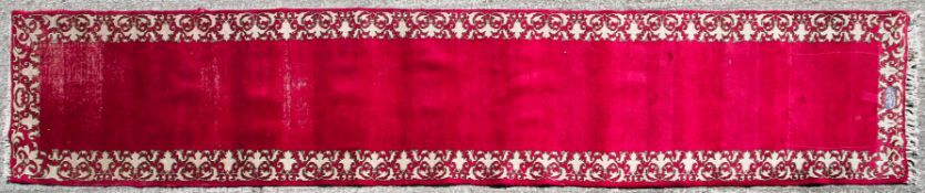 Tabriz old runner with a red ground and a border of red & cream.