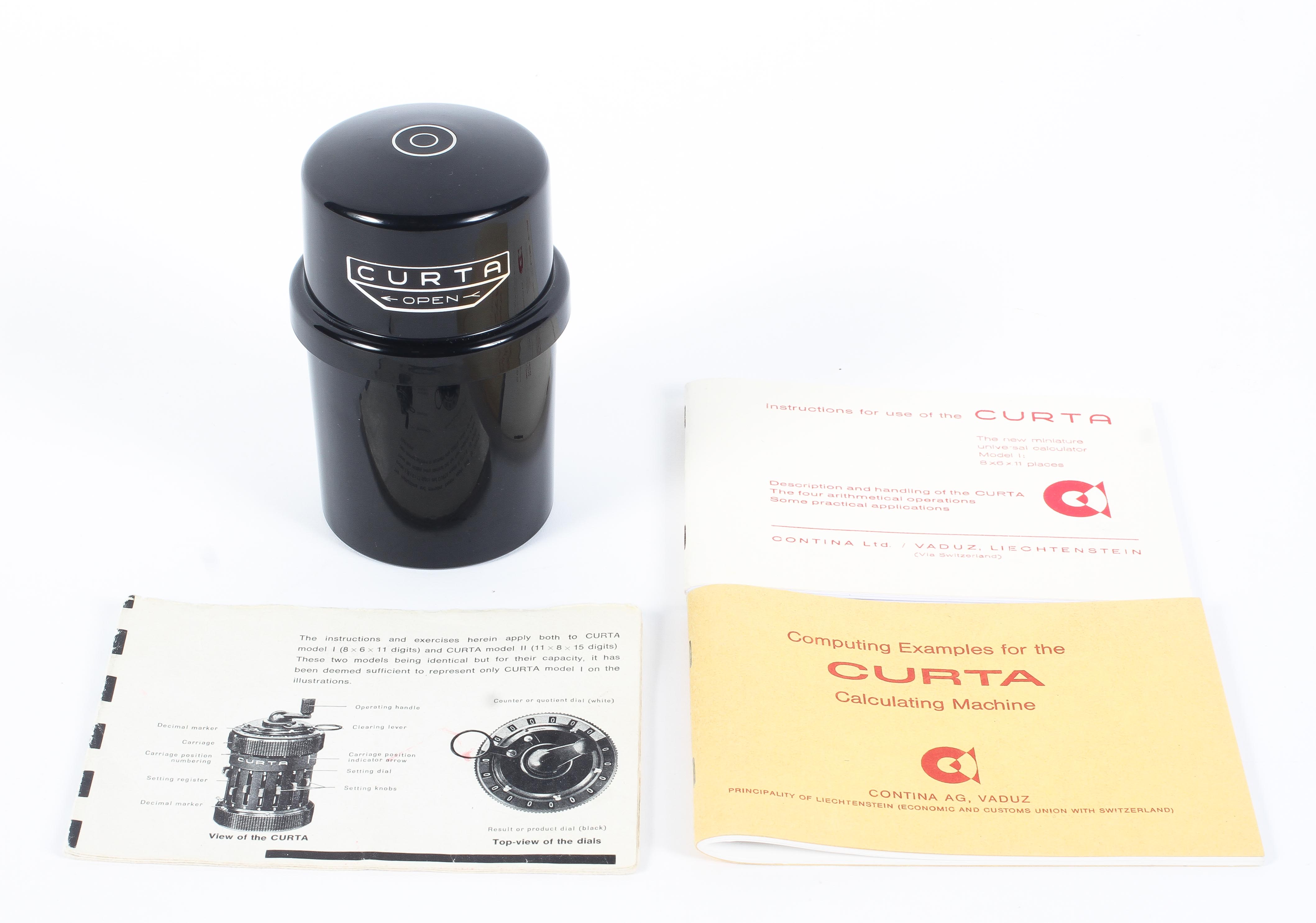 A Curta Mark 11 Calculator Serial No 539610. With associated case and instructions.