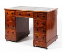 A Victorian mahogany twin pedestal kneehole desk.