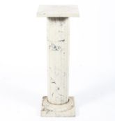 A composite marblised pedestal column.