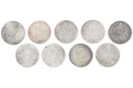 A collection of American dollar coins including reproduction and mid-19th century examples.