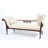 An Edwardian mahogany framed upholstered chaise longue.