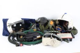 An assortment of militaria to include two military helmets, gas masks,