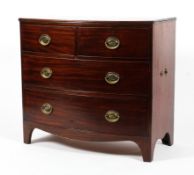 An early 19th century mahogany bow fronted chest of drawers.