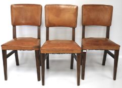 Three 20th century oak kitchen chairs.